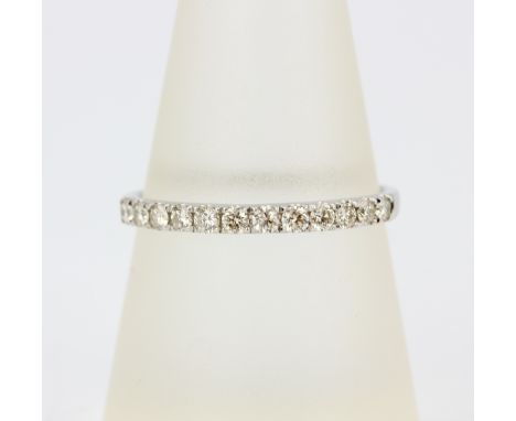 A 9ct white gold half eternity ring set with brilliant cut diamonds, approx. 0.33ct total, (Q.5).