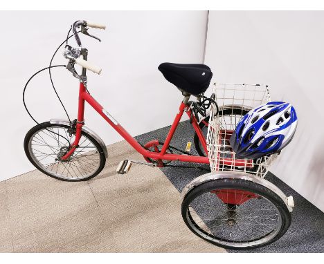 A Pashey Picador tricycle with Sturney Archer gears, bell, basket and helmet.