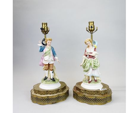 A pair of early 20th C French porcelain and brass table lamp bases, H. 40cm.