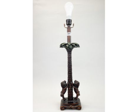 An interesting palm tree and two lions table lamp, H. 60cm.