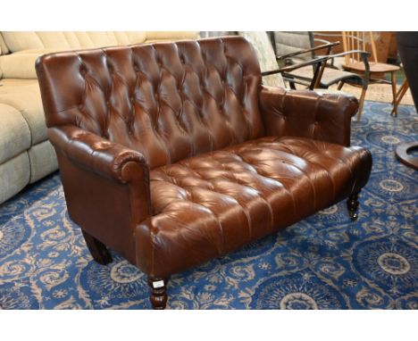 Brown leather two seater buttoned sofa, 135 cm long 