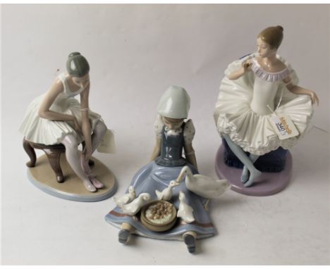 Two Nao figurines and one Lladro figurine