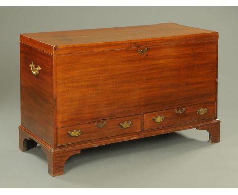 A George III mahogany crossbanded mule chest, fitted with two low drawers with moulded edge and raised on tall bracket feet. 