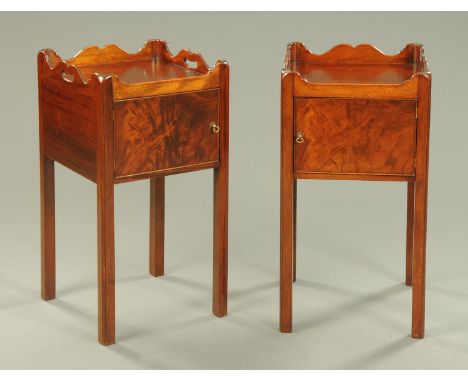 A pair of George III style mahogany bedside cabinets, with single door and raised on moulded legs of square section.  Width 3