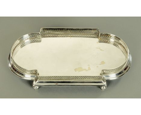 An Edwardian silver plated oval galleried tray, raised on ball feet.  Length 50 cm.