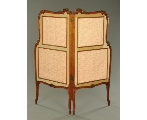 An Edwardian carved walnut two fold screen, raised on cabriole legs.  Width of each panel 69 cm.