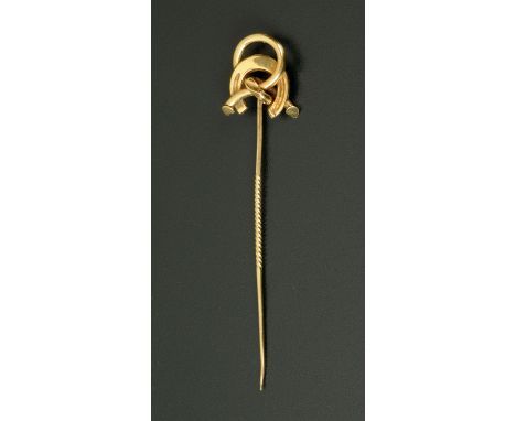 A gold coloured metal horseshoe stick pin, cased.  Length 82 mm.