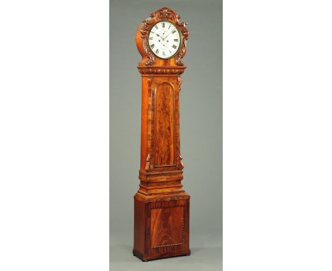 A 19th century mahogany longcase clock, with foliate carved hood, painted circular dial and eight day striking movement by Pa