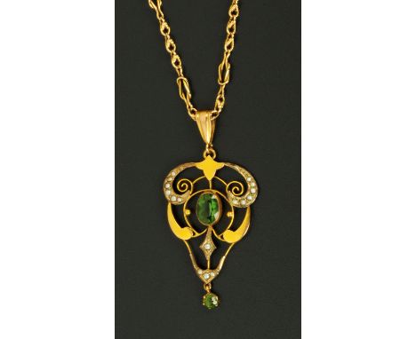 An Art Nouveau seed pearl and green stone pendant, stamped "9 ct" and with chain stamped "15 ct" (see illustration).