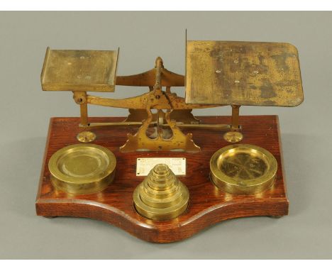 A large set of brass postal scales, late 19th century, by Samuel Turner Snr., the interior with STS monogram and supported up
