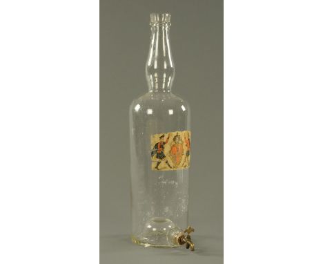 A large glass spirit bottle, late 19th century, with applied label Highland dancers around a coat of arms with legend "Bon Ac