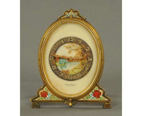 A gilt brass and Champleve enamel boudoir clock, the dial with river landscape decoration, Arabic numerals, with Swiss moveme