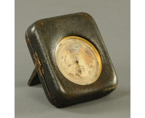 A brass mounted travelling barometer by Dollond of London in original easel back case.  Diameter 66 mm (see illustration). 