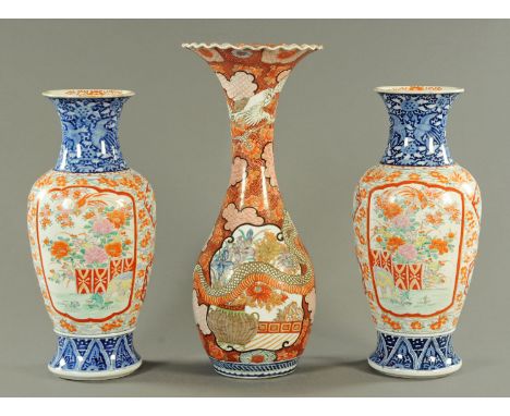 A pair of Japanese Kutani vases, circa 1900, having an underglazed blue neck with phoenix and lotus flower above panels of go
