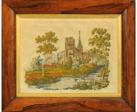 A Victorian woolwork tapestry, church in landscape.  35 cm x 48 cm, in rosewood frame. 