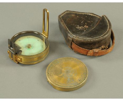 A brass cased pocket compass, marked "ISS", leather case. Diameter 76 mm (see illustration).