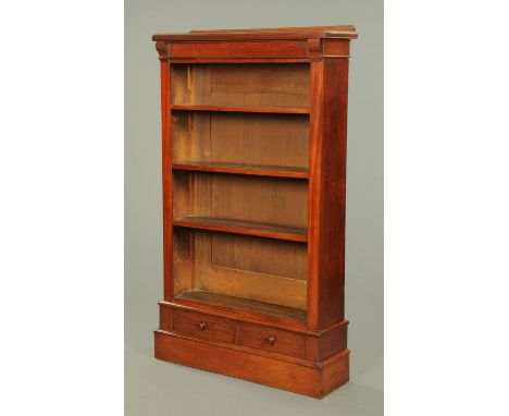 A Victorian mahogany open bookcase, with rear pediment, adjustable shelves and fitted with two drawers to the plinth base.  W