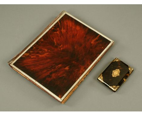 A silver mounted tortoiseshell and leather desk blotter, London 1920, 23 cm x 29 cm, and a tortoiseshell and gilt metal mount