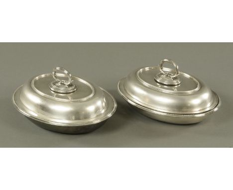 A pair of electroplated entree dishes and covers, William Hutton & Sons, circa 1900, with looping branch handle and beaded de