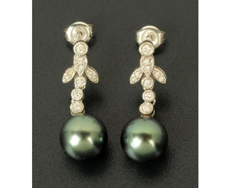 A pair of pearl and diamond drop earrings, white gold stamped "750".  Length 27 mm, 4.7 grams gross.    CONDITION REPORT:  In