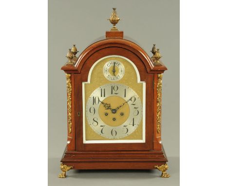 A large Edwardian mahogany bracket clock, with gilt metal mounts, engraved brass arched dial with chime/silent mechanism, sil