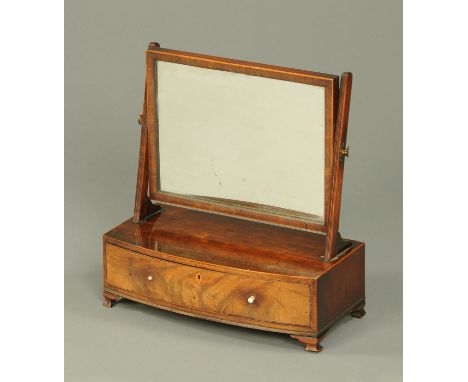 A 19th century mahogany dressing table mirror, with rectangular mirror frame and bowfronted base fitted with a drawer and rai