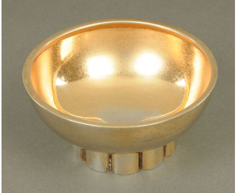 A silver gilt bowl, circular, raised on a fluted ring base, Birmingham 1964.  Diameter 9.6 cm, 99 grams.      CONDITION REPOR