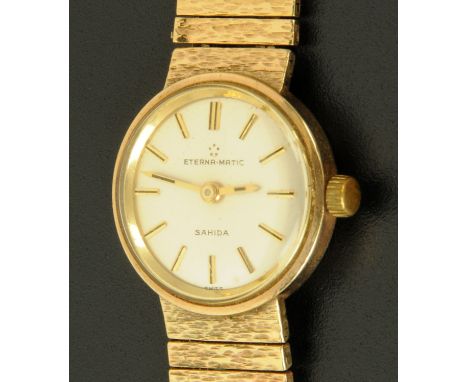 A ladies 9 ct gold cased Eterna-Matic Sahida wristwatch, on textured gold bracelet strap, London 1969, 34.1 grams gross, and 