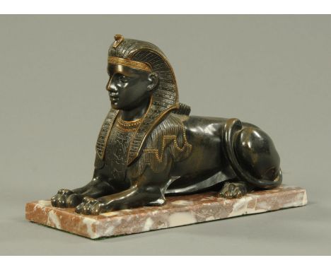 A Victorian bronze model of a sphinx, raised on a marble plinth.  Length 28 cm (see illustration).    CONDITION REPORT:  The 