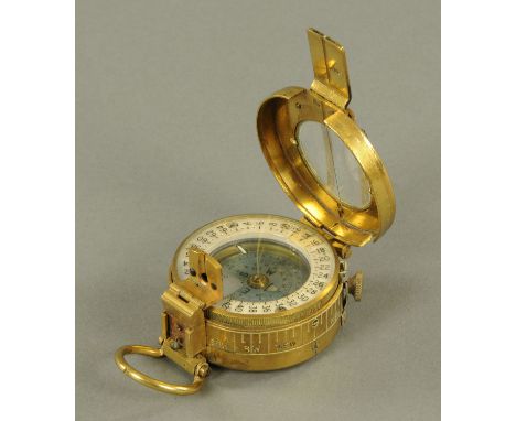 A military issue brass field compass, struck marks for T.G. Co. Ltd. London 1940.