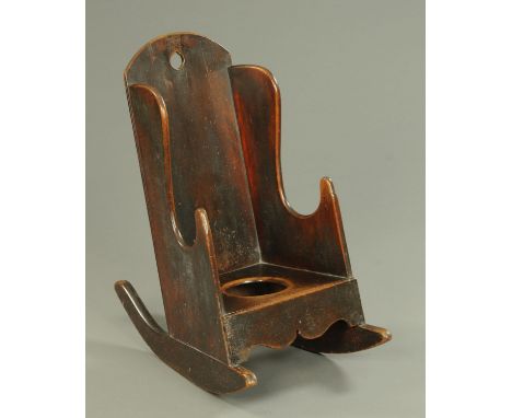 A 19th century child's commode rocking chair.  Width 37 cm. 