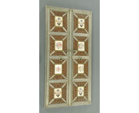 A pair of Indian pressed metal mounted four panelled doors, each inset with inlaid marble floral panels against a pierced cop