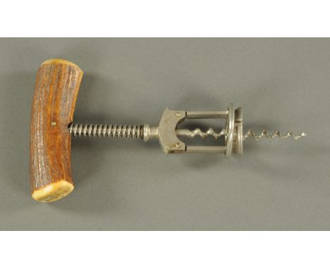 A Columbus type split frame corkscrew, late 19th/early 20th century, with stag antler handle, unmarked.  19.5 cm. 