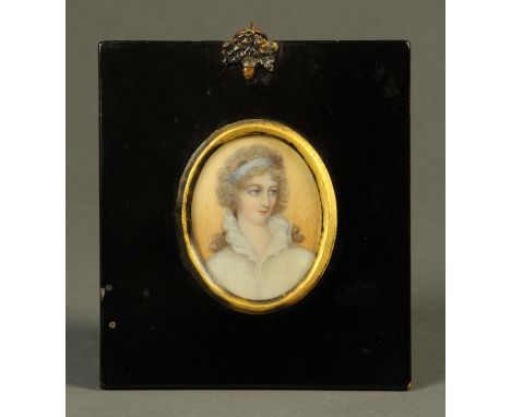 A 19th century portrait miniature on ivory, oval, female figure with blue band in hair.  65 mm x 55 mm, ebonised frame, acorn