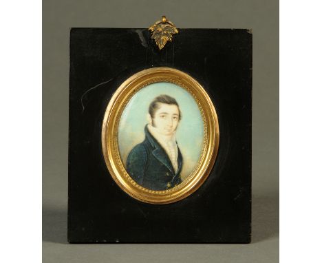 A 19th century portrait miniature on ivory, oval, gentleman with frock coat.  65 mm x 52 mm, ebonised frame, foliate hanger. 