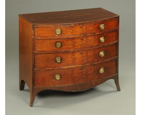A Georgian mahogany chest of drawers, early 19th century, with four graduated drawers, with well figured fiddleback top and r