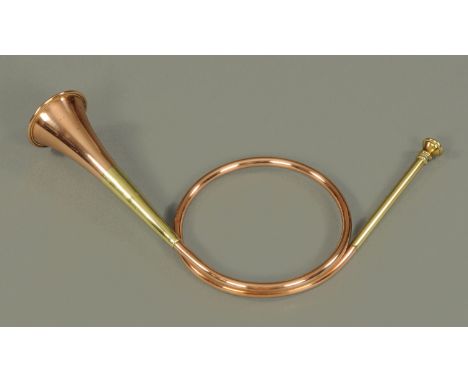 Three 19th century brass and copper hunting horns.  Longest 116 cm. 