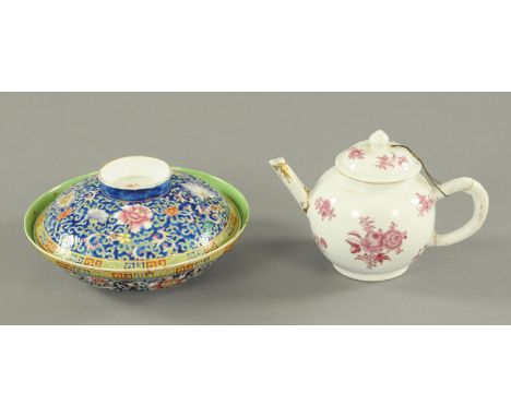 A Chinese Famille Rose bowl and cover, late 19th century, the enamel with lotus flowers amongst scrolling fronds against a da