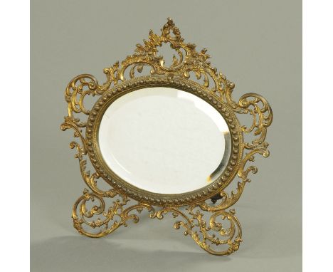 A late 19th/early 20th century easel back brass mirror, with bevelled glass.  Width 31 cm. 