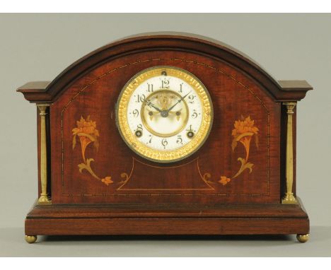 A mahogany and inlaid mantle clock, early 20th century, with visible Brocot escapement manufactured by the Ansonia Clock Co.,