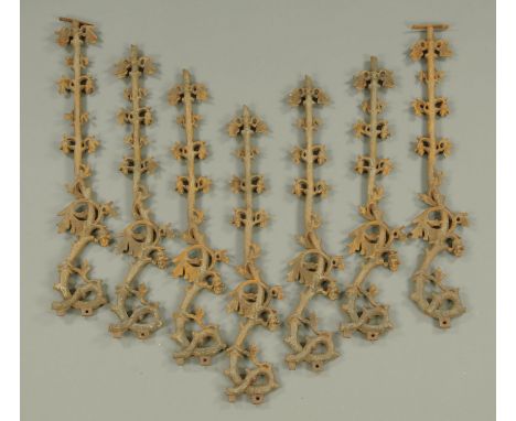 Seven wrought iron railings, 19th century, modelled with flowering vine around a trunk, each with lozenge and No. 88653.  Hei
