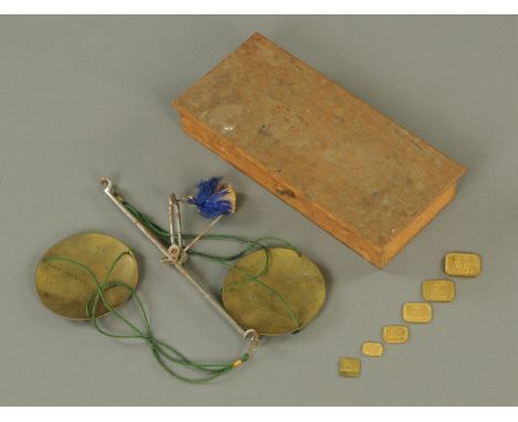 A cased set of balance scales, with gram weights.  Case width 20 cm. 