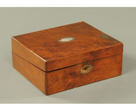 A burr walnut writing slope, 19th century, the lid inset with mother of pearl cartouche, interior with purple and gilt tooled