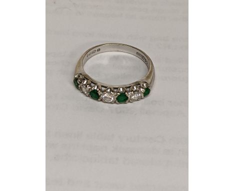 A 18ct gold ring set with diamonds and emeralds, 3.5gLocation: 