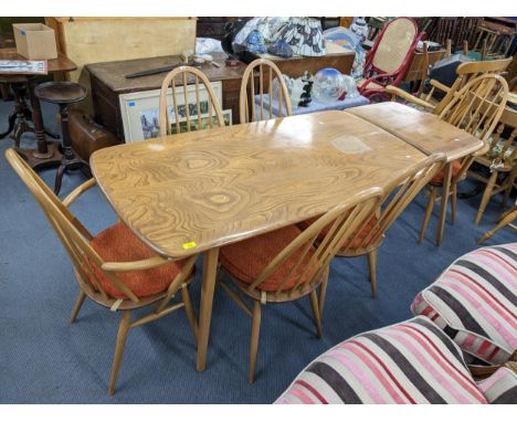 A vintage Ercol blonde elm and beech dining table with extension, together with six spindle back matching chairs, 71.5cm x 15