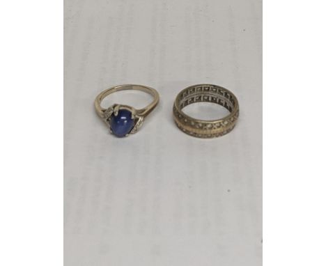 A ring stamped with 10k set with a blue stone and diamonds together with a 9ct ring set with white sapphires, total weight 7.