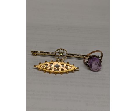 Two 9ct gold brooches, one with a steel pin, a 9ct gold and silver ring with purple stone, total weight 7.1gLocation: 