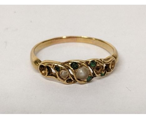 A yellow metal ring inset with pearls and paste green stones, 2.2gLocation: 