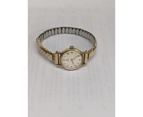 A ladies Omega manual wind 9ct gold wristwatch and a later expanding braceletLocation: 