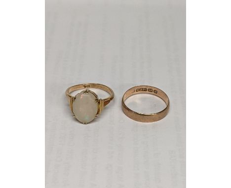 A 9ct gold opal ring together with a 9ct gold wedding band, total weight including opal stone 5.3gLocation: 